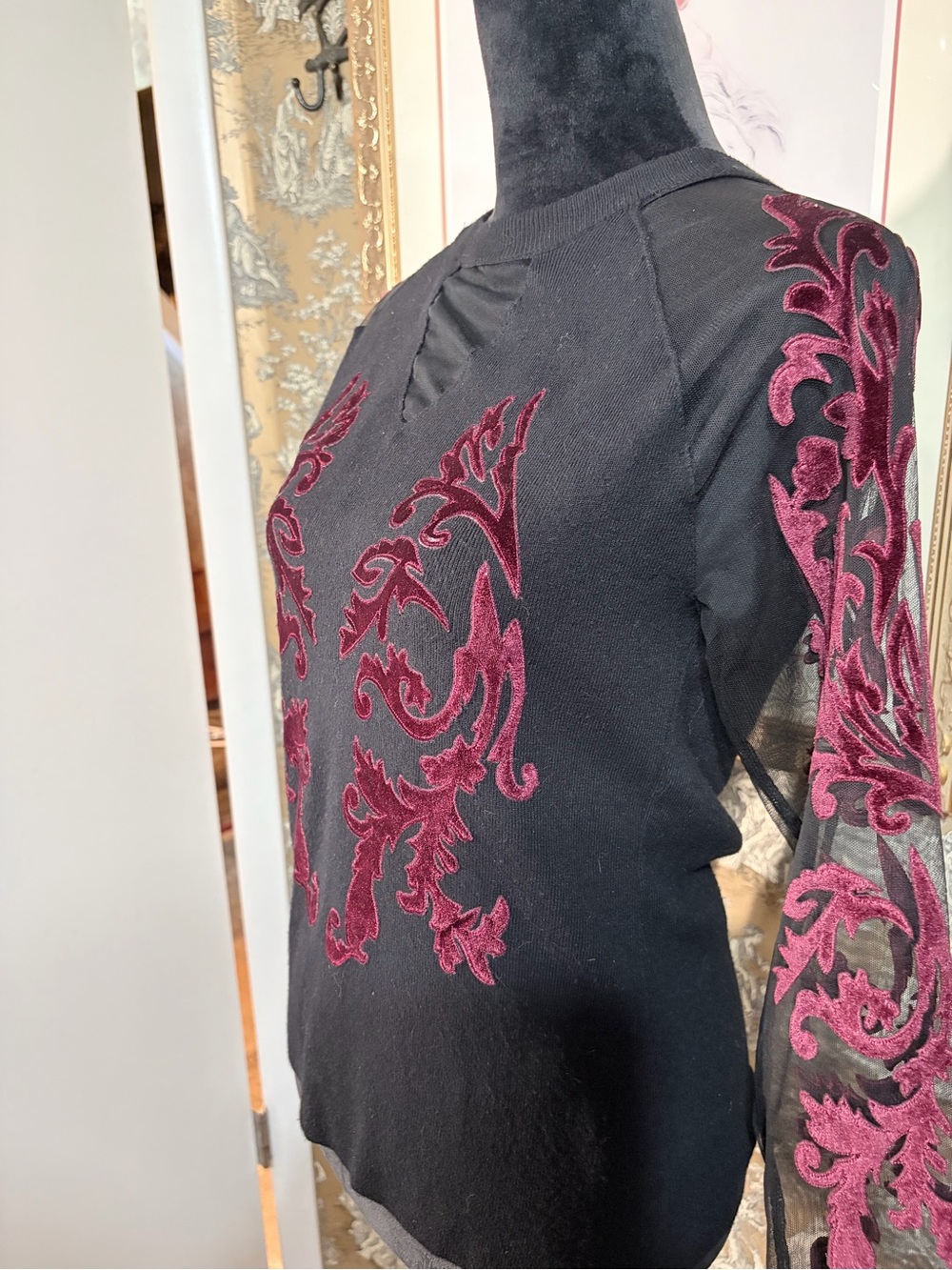 Coleen Lopez Black Sweater with Velvet Scroll Appliqué on Sleeves are Sheer.
